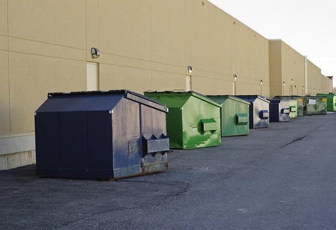 overhead shot of filled construction dumpsters in Hays